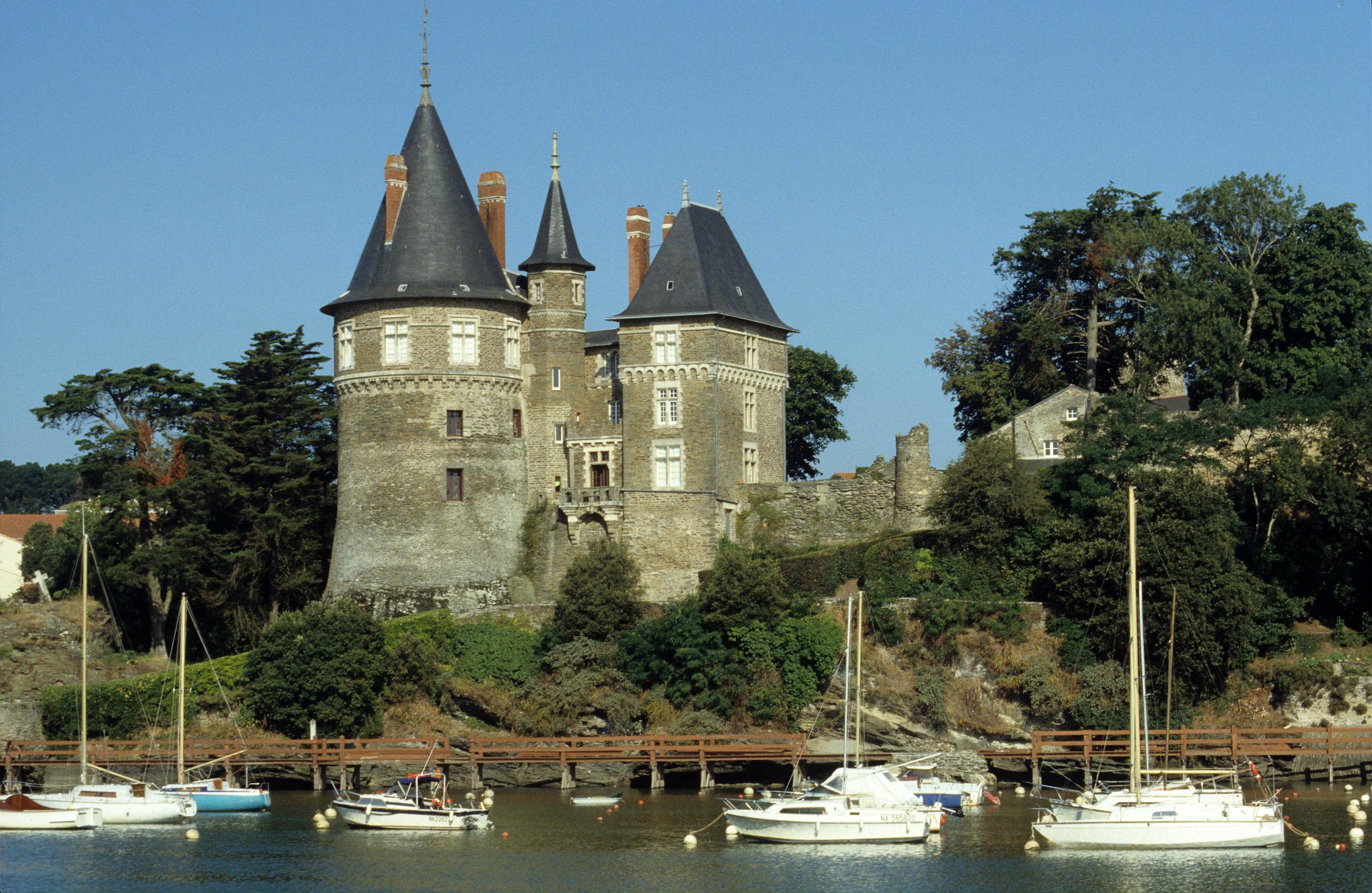 Gothic castle Château de Pornic with yachts, located in scenic Pornic, France.
